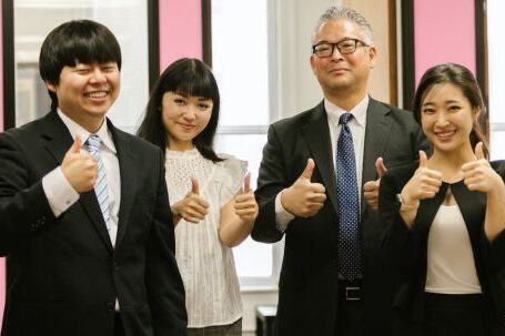 Boss Attire - Men and Women in Office Attire Giving Thumbs Up